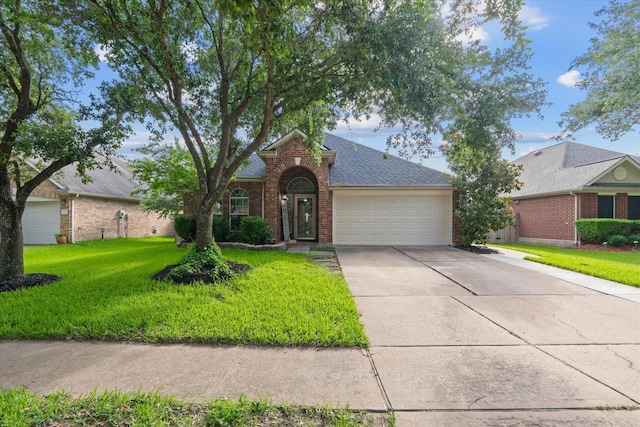 11411 Sugarbush Ridge Ln, Houston, TX 77089 - traditional-style house featuring brick siding, driveway, a garage, and a front yard