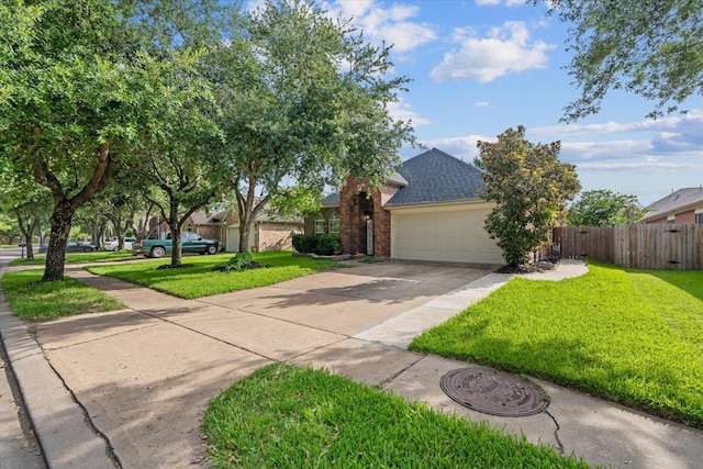 11411 Sugarbush Ridge Ln, Houston, TX 77089 - view of front of house featuring driveway, a garage, brick siding, and roof with shingles