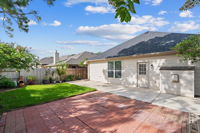 11411 Sugarbush Ridge Ln, Houston, TX 77089 - rear view of house featuring roof with shingles and a patio area