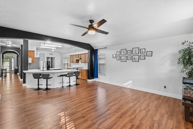 11411 Sugarbush Ridge Ln, Houston, TX 77089 - living room featuring arched walkways, wood finished floors, and ceiling fan