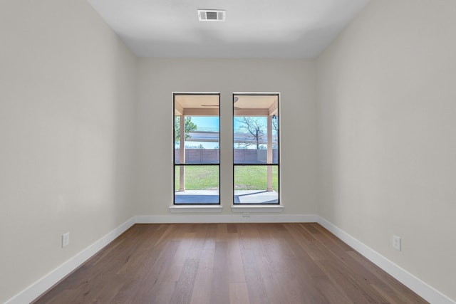 23135 Tranquil Springs Ln, Katy, TX 77494 - unfurnished room featuring dark wood-style floors and baseboards