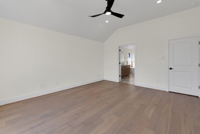 23135 Tranquil Springs Ln, Katy, TX 77494 - empty room with vaulted ceiling, ceiling fan, baseboards, wood finished floors, and recessed lighting