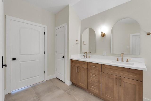 23135 Tranquil Springs Ln, Katy, TX 77494 - bathroom with double vanity, tile patterned flooring, and baseboards