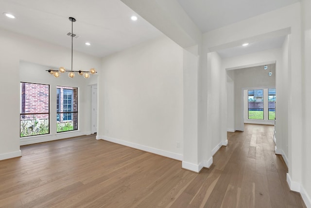 23135 Tranquil Springs Ln, Katy, TX 77494 - spare room with wood finished floors, baseboards, a chandelier, and recessed lighting