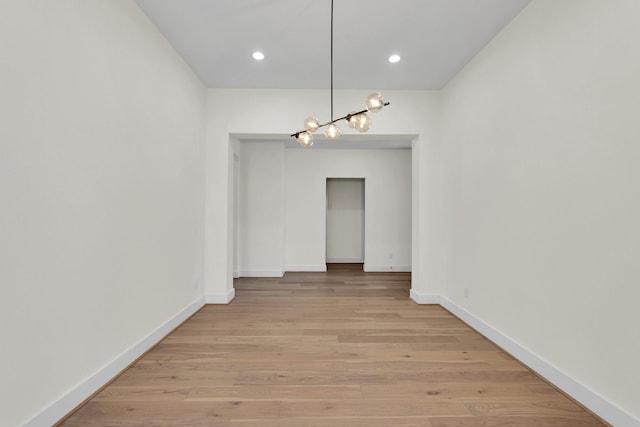 23135 Tranquil Springs Ln, Katy, TX 77494 - unfurnished dining area with light wood finished floors, baseboards, a chandelier, and recessed lighting