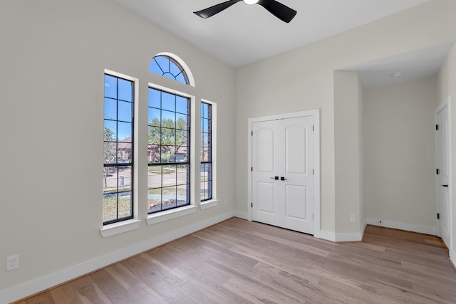 23135 Tranquil Springs Ln, Katy, TX 77494 - unfurnished bedroom featuring light wood-style floors, baseboards, and a ceiling fan