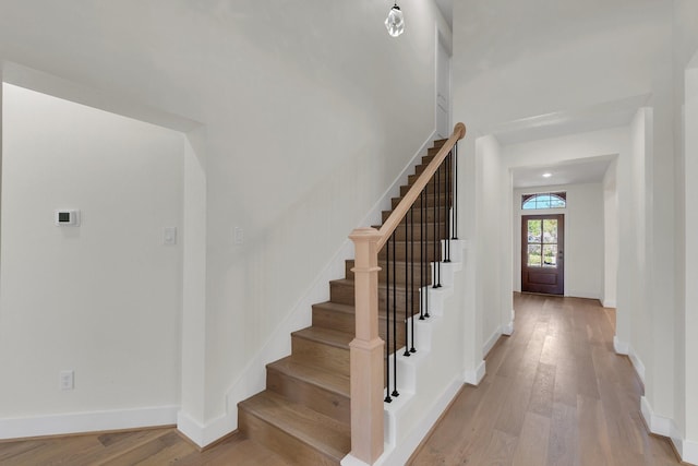 23135 Tranquil Springs Ln, Katy, TX 77494 - staircase featuring wood finished floors and baseboards