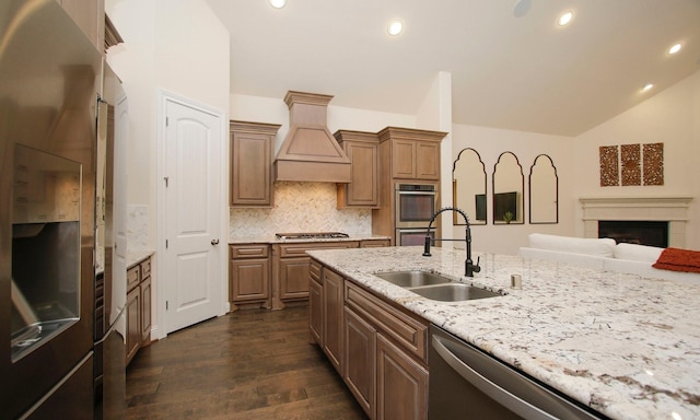 8823 Leaning Hollow Ln, Spring, TX 77379 - kitchen featuring appliances with stainless steel finishes, premium range hood, dark wood finished floors, recessed lighting, and backsplash