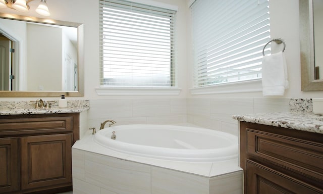 8823 Leaning Hollow Ln, Spring, TX 77379 - bathroom with vanity and a bath