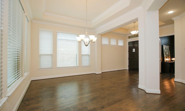 8823 Leaning Hollow Ln, Spring, TX 77379 - unfurnished dining area featuring a tray ceiling, a chandelier, dark wood-style floors, ornamental molding, and recessed lighting
