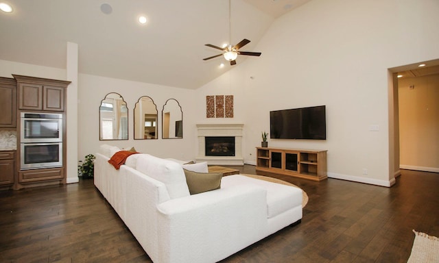 8823 Leaning Hollow Ln, Spring, TX 77379 - living room with recessed lighting, ceiling fan, dark wood finished floors, a glass covered fireplace, and high vaulted ceiling