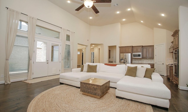 8823 Leaning Hollow Ln, Spring, TX 77379 - living area featuring dark wood-style flooring, ceiling fan, high vaulted ceiling, recessed lighting, and french doors