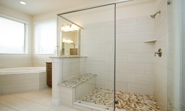 8823 Leaning Hollow Ln, Spring, TX 77379 - full bath featuring vanity, a stall shower, a bath, tile patterned flooring, and recessed lighting
