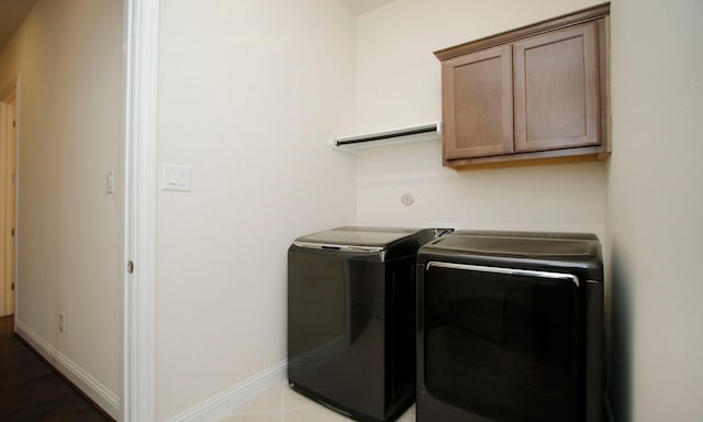 8823 Leaning Hollow Ln, Spring, TX 77379 - laundry area with separate washer and dryer and cabinet space