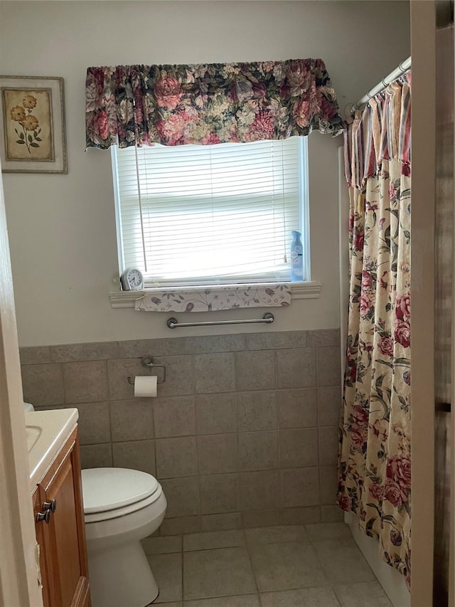 1733 Brumbelow St, Rosenberg, TX 77471 - bathroom with tile walls, toilet, vanity, tile patterned floors, and a shower with curtain