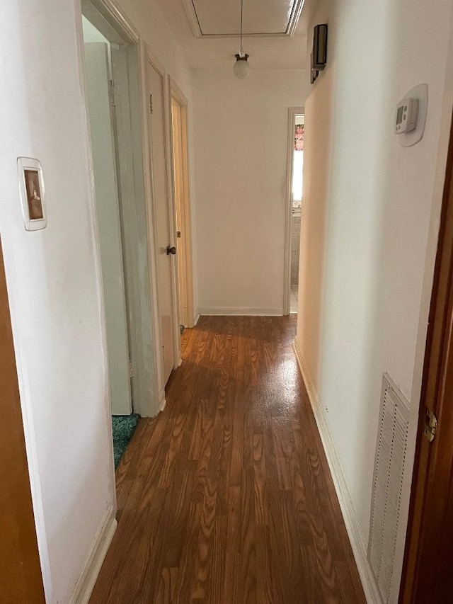 1733 Brumbelow St, Rosenberg, TX 77471 - corridor featuring attic access, dark wood finished floors, and baseboards