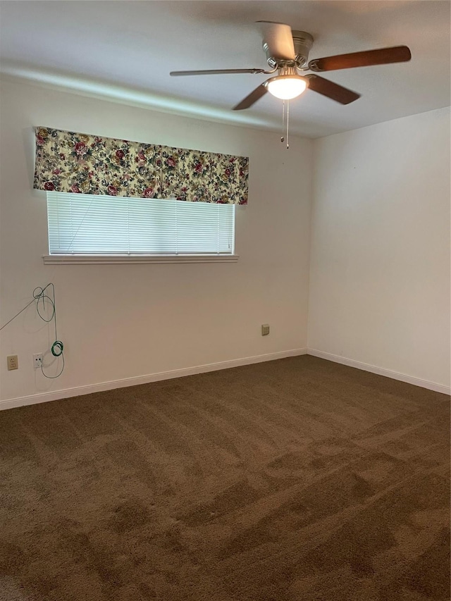 1733 Brumbelow St, Rosenberg, TX 77471 - unfurnished room with ceiling fan, dark carpet, and baseboards