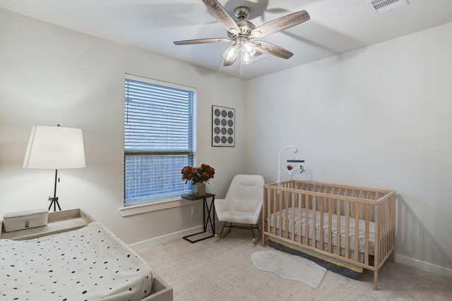 20923 Grand Surprise Ct, Cypress, TX 77433 - bedroom featuring baseboards, a crib, carpet floors, and a ceiling fan