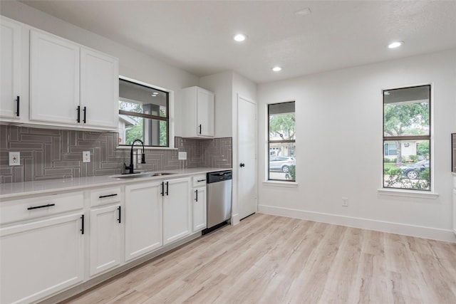 12034 Audubon Hill Ct, Houston, TX 77038 - kitchen with dishwasher, tasteful backsplash, plenty of natural light, and recessed lighting
