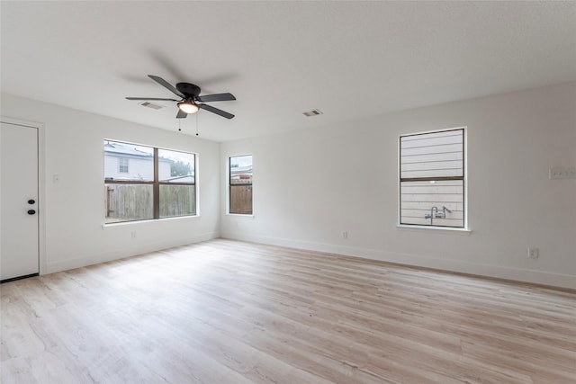 12034 Audubon Hill Ct, Houston, TX 77038 - unfurnished room with light wood-style flooring, ceiling fan, and baseboards