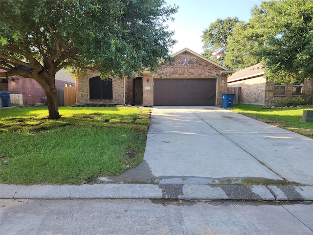 19103 Painted Blvd, Porter, TX 77365 - obstructed view of property featuring an attached garage, brick siding, and driveway
