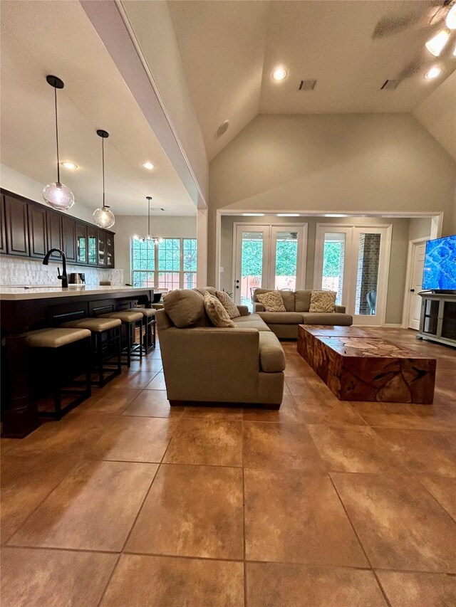 15127 Turquoise Mist Dr, Cypress, TX 77433 - living area with vaulted ceiling, light tile patterned floors, and recessed lighting