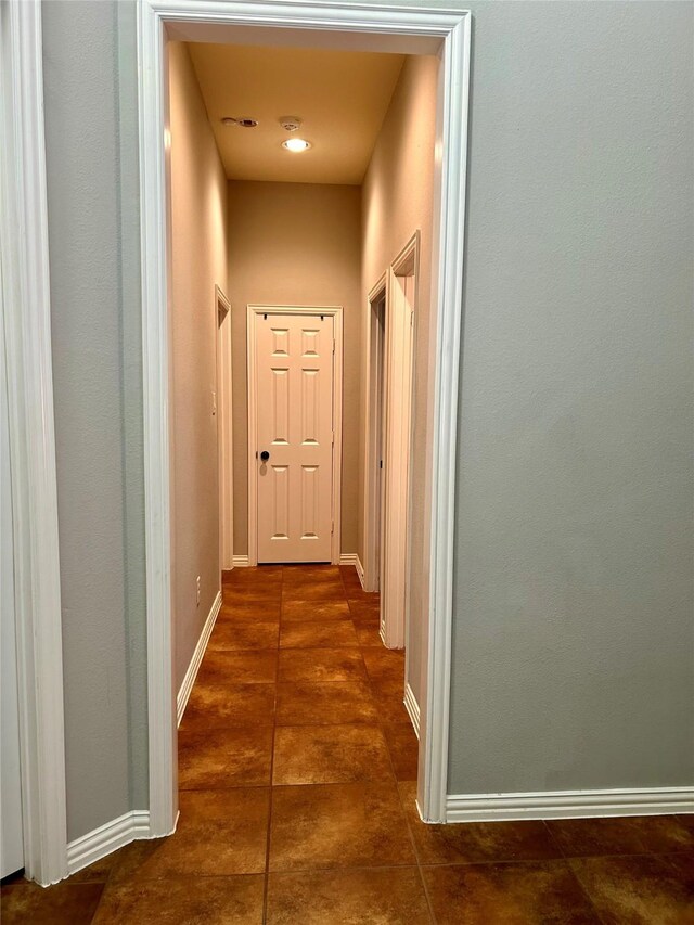 15127 Turquoise Mist Dr, Cypress, TX 77433 - corridor with dark tile patterned flooring and baseboards