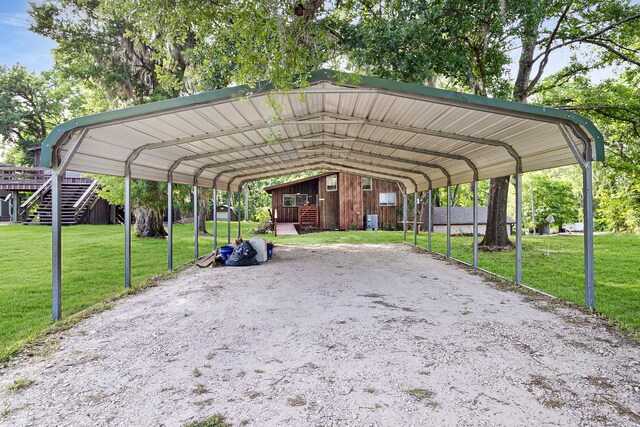 12 Walker Trl, Huntsville, TX 77320 - view of home's community featuring a detached carport and a yard