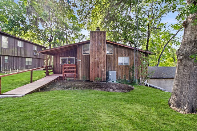 12 Walker Trl, Huntsville, TX 77320 - view of outdoor structure with central AC unit
