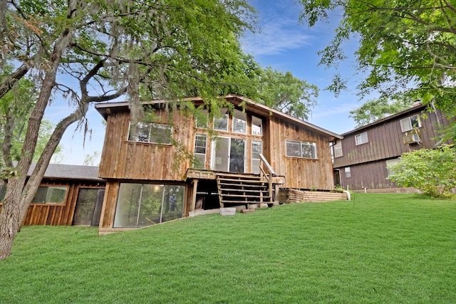 12 Walker Trl, Huntsville, TX 77320 - back of house featuring a lawn and a deck