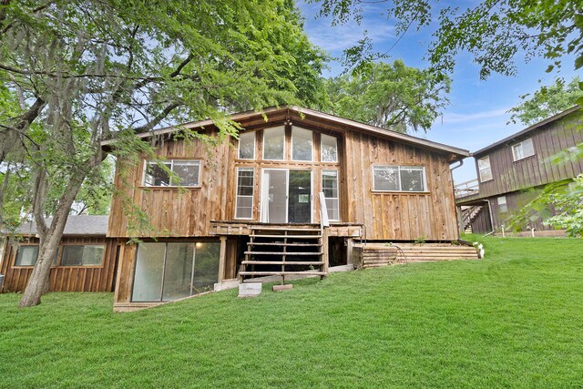 12 Walker Trl, Huntsville, TX 77320 - back of property featuring a yard and a wooden deck