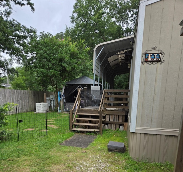 100 St Croix Dr, Point Blank, TX 77364 - view of yard with a deck and a carport