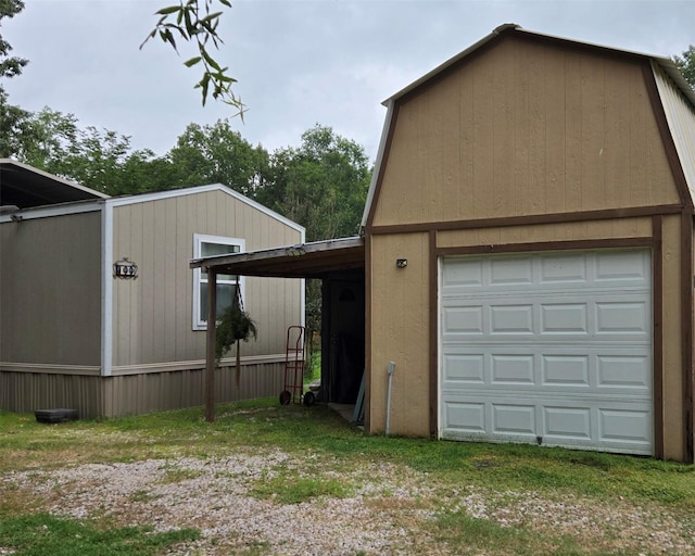 100 St Croix Dr, Point Blank, TX 77364 - view of side of property featuring a detached garage and an outdoor structure