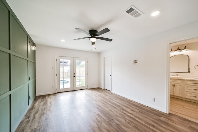 2742 Triway Ln, Houston, TX 77043 - unfurnished bedroom with access to outside, french doors, light wood finished floors, baseboards, and connected bathroom