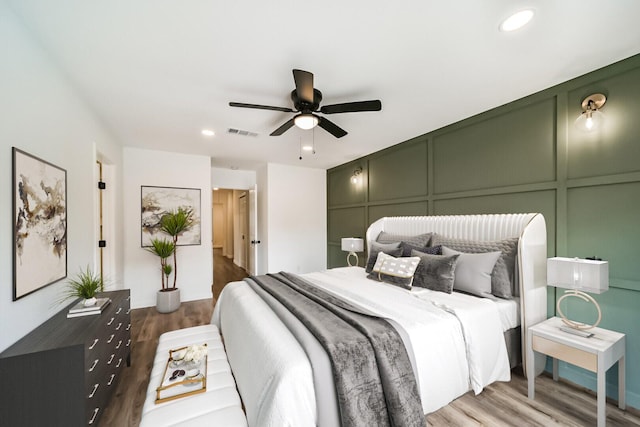 2742 Triway Ln, Houston, TX 77043 - bedroom with a decorative wall, wood finished floors, recessed lighting, and a ceiling fan