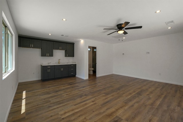 2742 Triway Ln, Houston, TX 77043 - unfurnished living room featuring ceiling fan, healthy amount of natural light, baseboards, dark wood finished floors, and recessed lighting