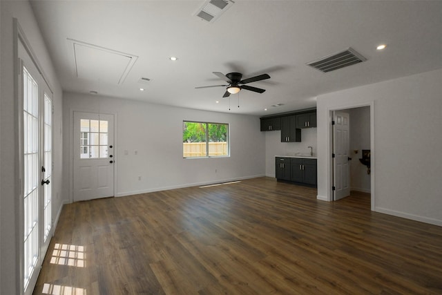 2742 Triway Ln, Houston, TX 77043 - unfurnished living room with attic access, a sink, dark wood-style floors, baseboards, and recessed lighting