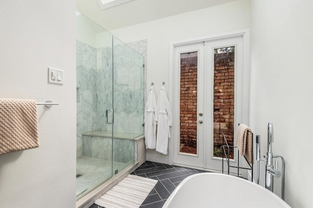 9410 Windrush Dr, Spring, TX 77379 - bathroom featuring a freestanding tub and a shower stall