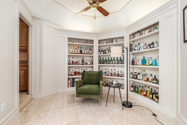 9410 Windrush Dr, Spring, TX 77379 - sitting room featuring a dry bar, built in features, and a ceiling fan