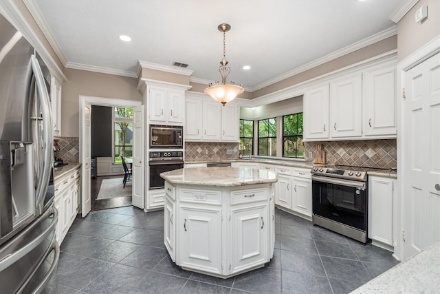 9410 Windrush Dr, Spring, TX 77379 - kitchen with black appliances, white cabinets, decorative backsplash, recessed lighting, and ornamental molding
