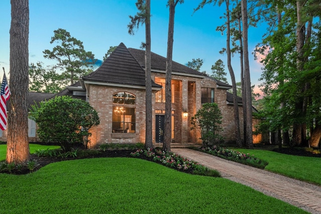 9410 Windrush Dr, Spring, TX 77379 - view of front of home with brick siding and a front lawn