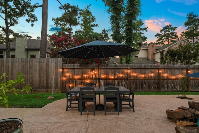 9410 Windrush Dr, Spring, TX 77379 - fenced backyard with a patio area and outdoor dining space