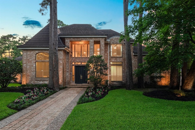 9410 Windrush Dr, Spring, TX 77379 - french country inspired facade featuring brick siding and a front lawn