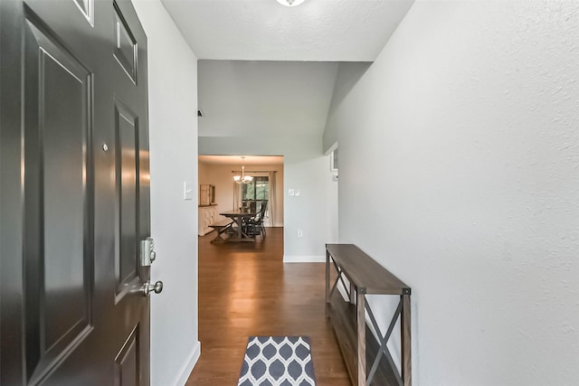 120311/2 N L St, La Porte, TX 77571 - foyer featuring dark wood finished floors, a chandelier, and baseboards