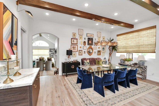 7153 Fm 1458th Rd, Sealy, TX 77474 - dining space featuring arched walkways, beam ceiling, light wood-type flooring, recessed lighting, and a chandelier