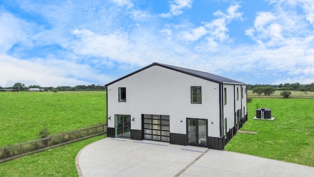 7153 Fm 1458th Rd, Sealy, TX 77474 - view of side of home with concrete driveway, cooling unit, and a view of rural / pastoral area