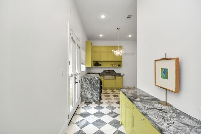 7153 Fm 1458th Rd, Sealy, TX 77474 - kitchen with green cabinetry, light flooring, recessed lighting, pendant lighting, and a sink
