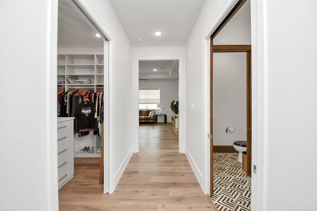 7153 Fm 1458th Rd, Sealy, TX 77474 - hallway with light wood-style floors, recessed lighting, and baseboards