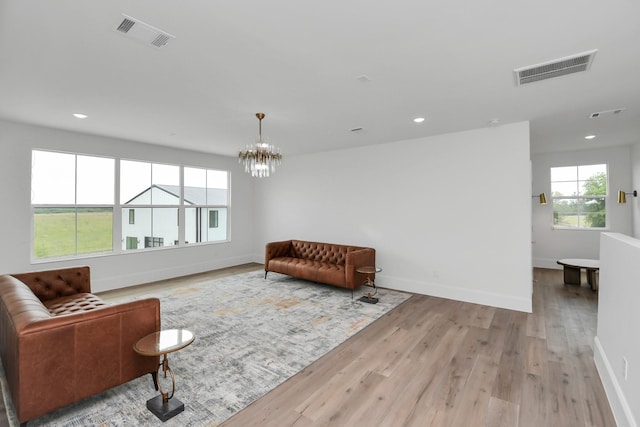 7153 Fm 1458th Rd, Sealy, TX 77474 - sitting room featuring a chandelier, baseboards, wood finished floors, and recessed lighting