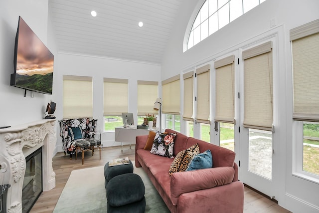 7153 Fm 1458th Rd, Sealy, TX 77474 - sunroom with healthy amount of natural light, wood finished floors, high vaulted ceiling, and wooden ceiling